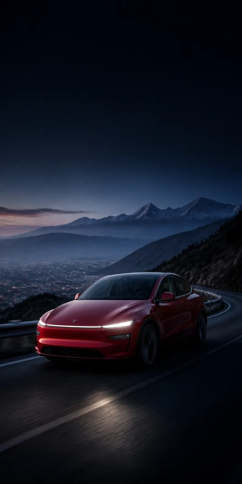 Red electric car travelling on a Himalayan mountain road