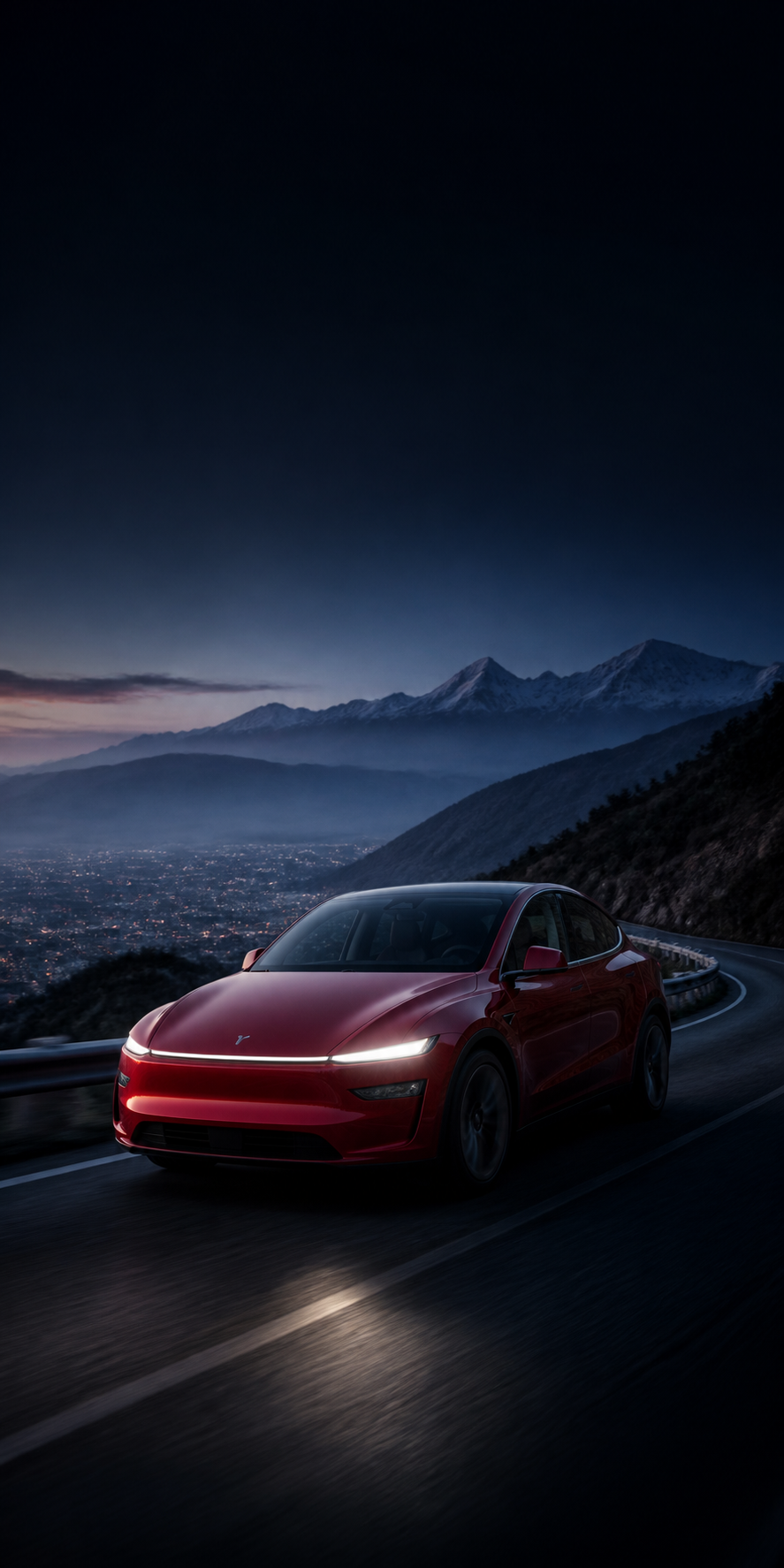 Red electric car travelling on a Himalayan mountain road