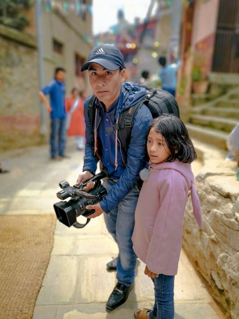 Filmmaker with a video camera representing Nepal's new cinema generation