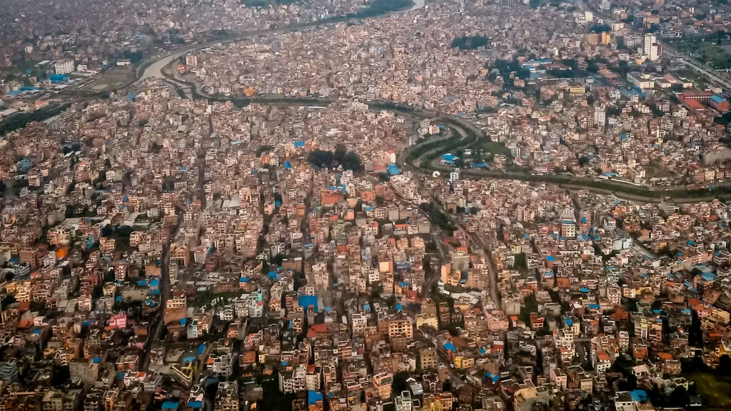 Dense Kathmandu city rooftops and buildings, illustrating independent urban living in Nepal
