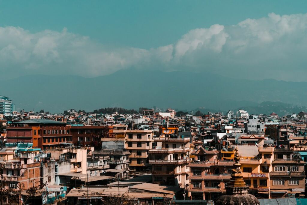 Kathmandu city and surrounding mountains representing building and managing a business in Nepal from abroad