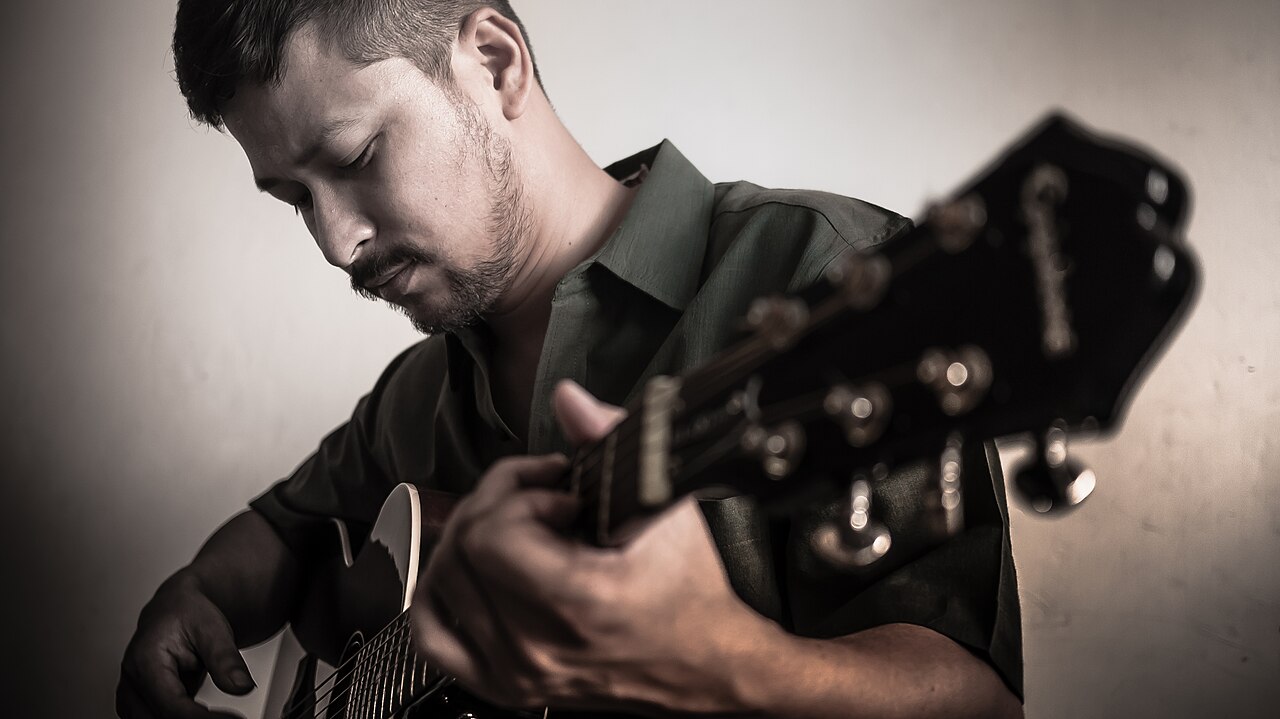 Nepali singer-songwriter Bipul Chettri playing acoustic guitar, archival photograph