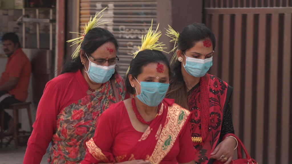 Nepali women wearing tika and jamara during Dashain celebrations