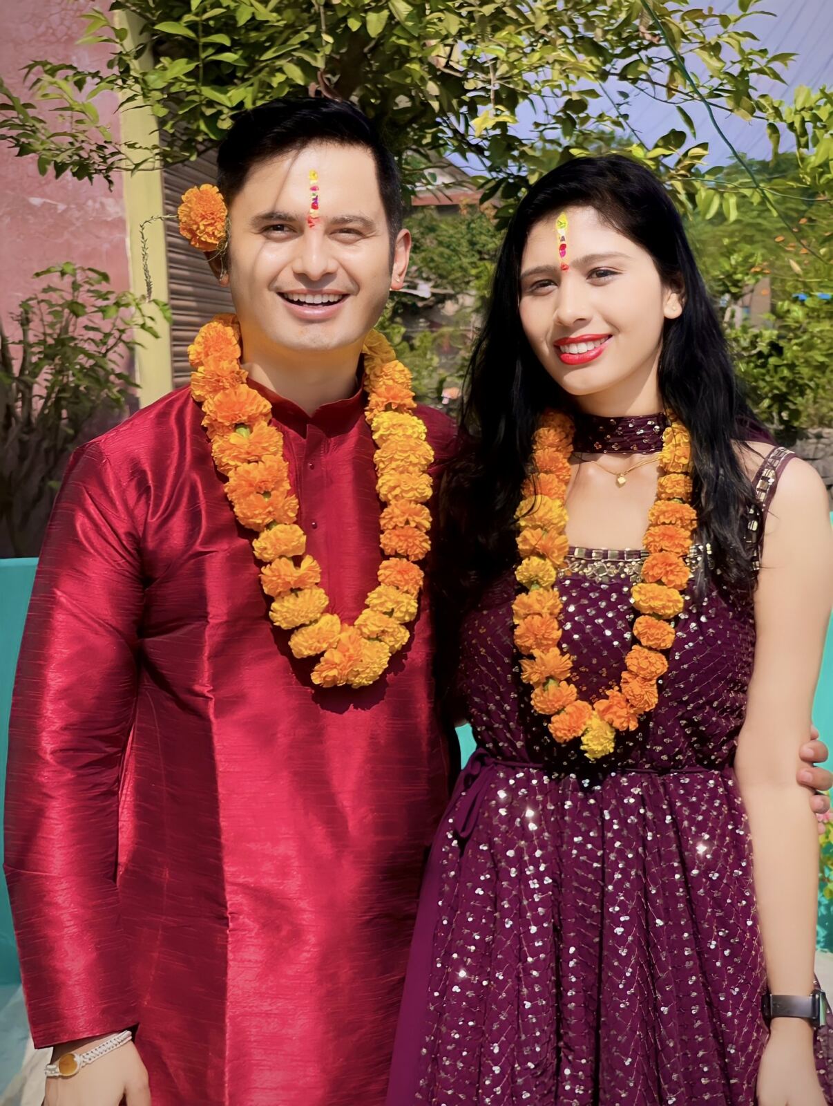 Brother and sister with flower garlands and tika celebrating Tihar in Nepal