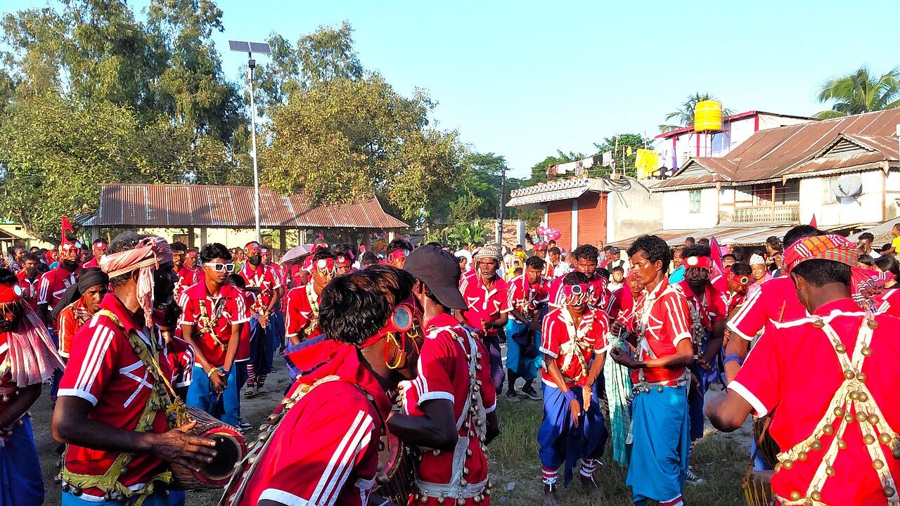 Santhal community in Jhapa, Nepal playing traditional instruments and dancing during Dashain