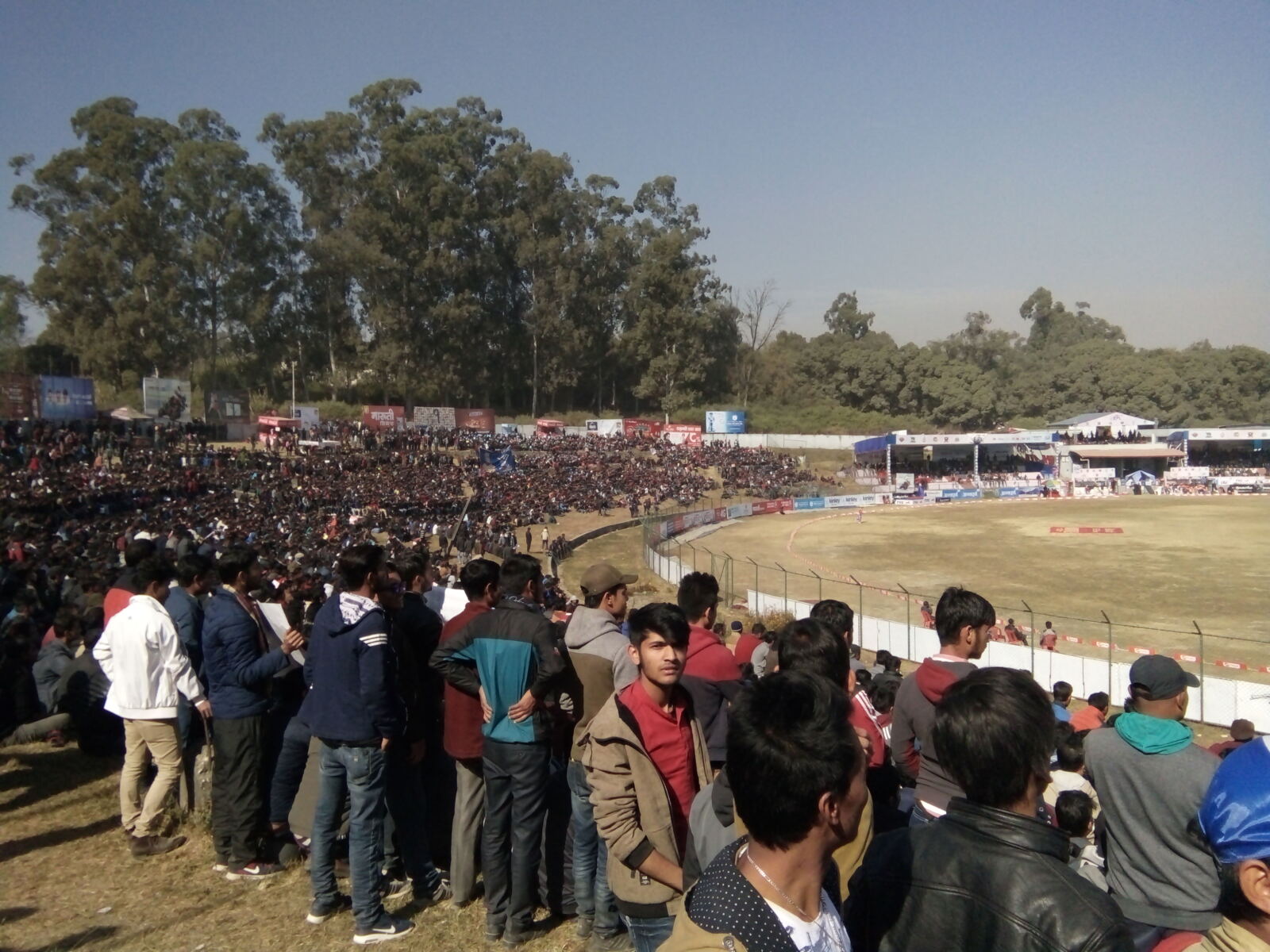 Players on Kirtipur cricket ground during a national-league match in December 2017; archive photograph.
