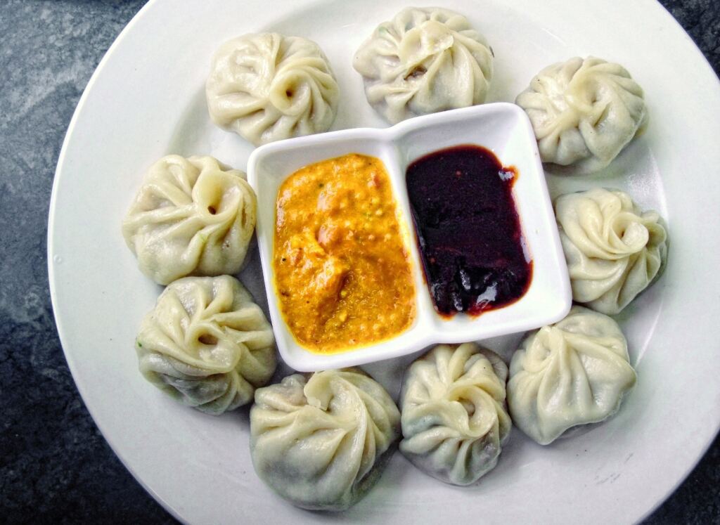 Nepali momo with sauces representing regional cuisine