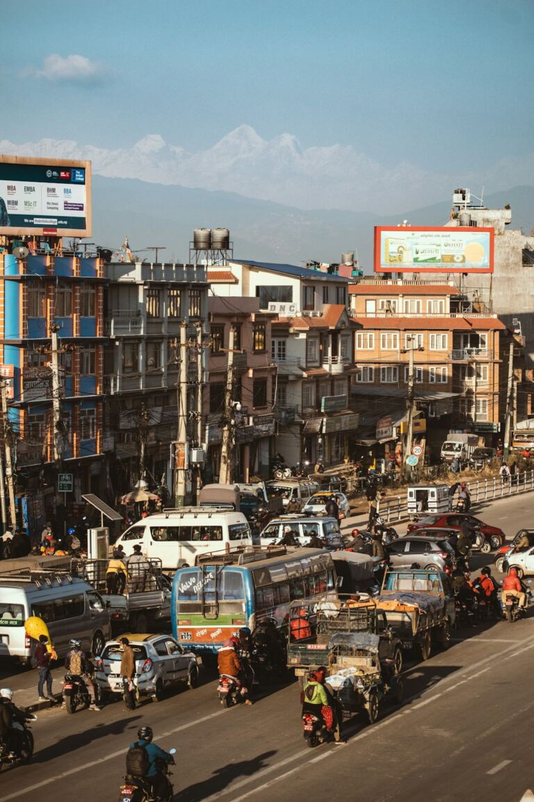 Urban traffic and public transport with mountains in the distance